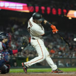 
              San Francisco Giants' Austin Wynns hits a single against the Atlanta Braves during the fourth inning of a baseball game in San Francisco, Monday, Sept. 12, 2022. (AP Photo/Godofredo A. Vásquez)
            
