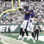 
              Baltimore Ravens wide receiver Rashod Bateman, left, celebrates with teammate Demarcus Robinson after scoring a touchdown during the second half of an NFL football game against the New York Jets, Sunday, Sept. 11, 2022, in East Rutherford, N.J. (AP Photo/Adam Hunger)
            
