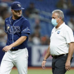 
              Tampa Bay Rays starting pitcher Shane McClanahan, left, looks back at trainer Mike Sandoval after being taken out of the game against the Houston Astros during the fifth inning of a baseball game Tuesday, Sept. 20, 2022, in St. Petersburg, Fla. (AP Photo/Chris O'Meara)
            