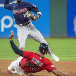 
              Minnesota Twins' Nick Gordon, top, forces out Cleveland Guardians' Will Benson (29) at second base and completes a double play by throwing out Luke Maile at first during the fifth inning of the second game of a baseball doubleheader in Cleveland, Saturday, Sept. 17, 2022. (AP Photo/Phil Long)
            