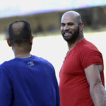 
              St. Louis Cardinals designated hitter Albert Pujols, right, speaks to Los Angeles Dodgers third base coach Dino Ebel before a baseball game Saturday, Sept. 24, 2022, in Los Angeles. (AP Photo/Raul Romero Jr.)
            