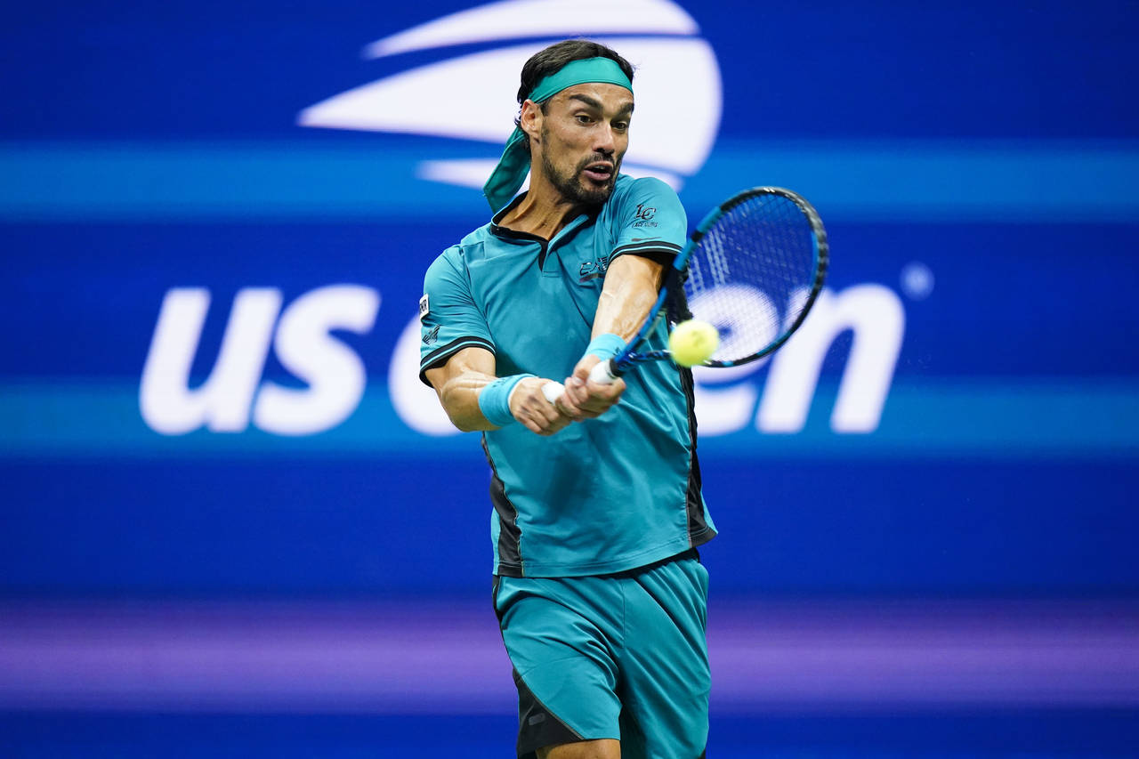Fabio Fognini, of Italy, returns a shot to Rafael Nadal, of Spain, during the second round of the U...
