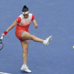 
              Ons Jabeur, of Tunisia, attempts to return a shot to Iga Swiatek, of Poland, during the women's singles final of the U.S. Open tennis championships, Saturday, Sept. 10, 2022, in New York. (AP Photo/Mary Altaffer)
            