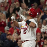 
              St. Louis Cardinals' Albert Pujols celebrates after hitting a solo home run during the fourth inning of a baseball game against the Pittsburgh Pirates Friday, Sept. 30, 2022, in St. Louis. (AP Photo/Jeff Roberson)
            