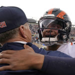 
              Chicago Bears quarterback Justin Fields, right, hugs coach Matt Eberflus after an NFL football game against the Houston Texans Sunday, Sept. 25, 2022, in Chicago. The Bears won 23-20. (AP Photo/Nam Y. Huh)
            