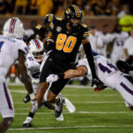 
              Missouri tight end Tyler Stephens (80) runs with the ball as Louisiana Tech linebacker Maki Carabin (44) defends during the first half of an NCAA college football game Thursday, Sept. 1, in Columbia, Mo. (AP Photo/L.G. Patterson)
            