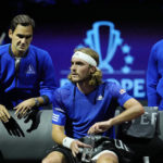 
              Europe's Stefanos Tsitsipas, center, talks to his teammate Roger Federer of Switzerland during a match on day one of the Laver Cup tennis tournament at the O2 in London, Friday, Sept. 23, 2022. (AP Photo/Kin Cheung)
            