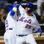 
              New York Mets' Pete Alonso, right, celebrates with Brandon Nimmo after Alonso hit a three-run home run during the fourth inning of the team's baseball game against the Miami Marlins on Tuesday, Sept. 27, 2022, in New York. (AP Photo/Frank Franklin II)
            
