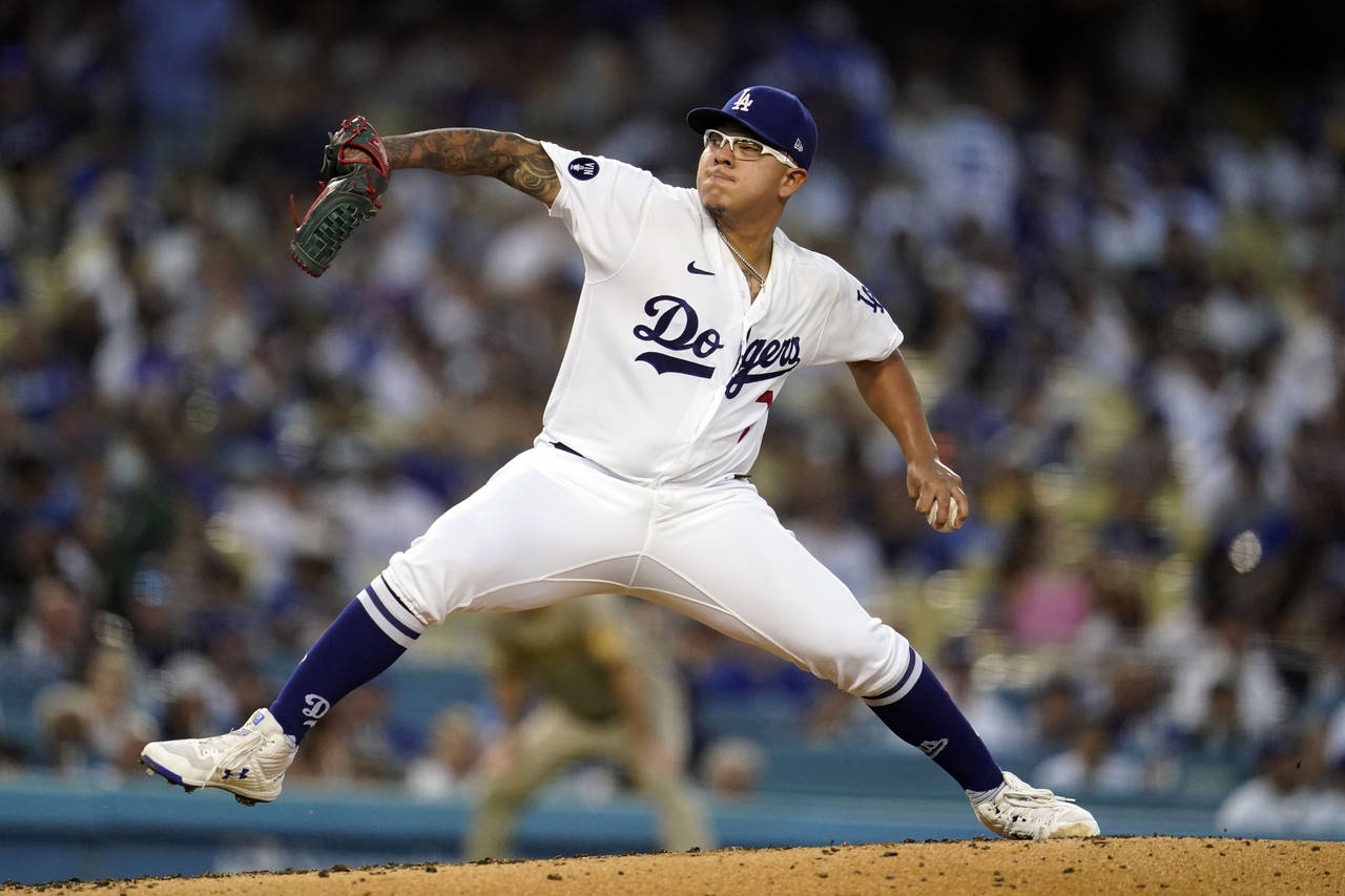 Los Angeles Dodgers starting pitcher Julio Urias throws to a San Diego Padres batter during the fou...