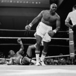 
              FILE - Earnie Shavers walks to a neutral corner after he knocked out Ken Norton in the first round of their March 23, 1979, boxing bout in Las Vegas. Shavers, whose thunderous punches stopped 68 fighters and earned him heavyweight title fights with Muhammad Ali and Larry Holmes, died Thursday, Sept. 1, 2022. He was 78. (AP Photo/Jim Palmer, File)
            