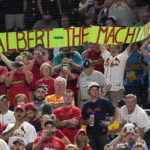 
              St. Louis Cardinals fans hold up a sign for Albert Pujols as he comes to bat against the Pittsburgh Pirates during the eighth inning of a baseball game Friday, Sept. 9, 2022, in Pittsburgh. (AP Photo/Keith Srakocic)
            