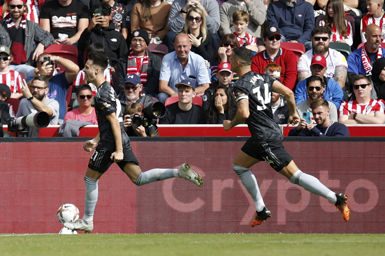 Arsenal's Fabio Vieiras celebrates with his teammates after scoring his side's third goal during th...