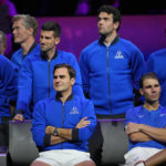 
              An emotional Roger Federer, left, of Team Europe sits alongside his playing partner Rafael Nadal after their Laver Cup doubles match against Team World's Jack Sock and Frances Tiafoe at the O2 arena in London, Friday, Sept. 23, 2022. Federer's losing doubles match with Nadal marked the end of an illustrious career that included 20 Grand Slam titles and a role as a statesman for tennis. (AP Photo/Kin Cheung)
            
