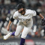 
              Colorado Rockies relief pitcher Chad Smith works the San Francisco Giants in the sixth inning of a baseball game, Monday, Sept. 19, 2022, in Denver. (AP Photo/David Zalubowski)
            