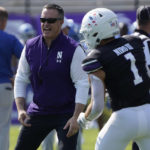 
              Northwestern head coach Pat Fitzgerald talks with wide receiver Raymond Niro III (1) before the game against Duke an NCAA college football game, Saturday, Sept.10, 2022, in Evanston, Ill. (AP Photo/David Banks)
            