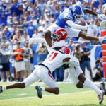 
              Kentucky wide receiver Tayvion Robinson (9) is stopped at the short of the end zone by Youngstown State defensive back Tyjon Jones (4) and defensive back Jordan Trowers (11) during the first half of an NCAA college football game in Lexington, Ky., Saturday, Sept. 17, 2022. (AP Photo/Michael Clubb)
            
