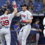 
              Boston Red Sox's Triston Casas, center, is congratulated by Christian Arroyo on his two-run home run, next to Tampa Bay Rays catcher Francisco Mejia during the second inning of a baseball game Tuesday, Sept. 6, 2022, in St. Petersburg, Fla. (AP Photo/Mike Carlson)
            