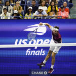 
              Casper Ruud, of Norway, serves to Carlos Alcaraz, of Spain, during the men's singles final of the U.S. Open tennis championships, Sunday, Sept. 11, 2022, in New York. (AP Photo/Matt Rourke)
            