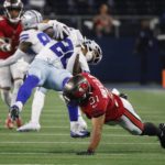 
              Dallas Cowboys running back Tony Pollard (20) is stopped after a short gain by Tampa Bay Buccaneers safety Antoine Winfield Jr. (31) in the second half of a NFL football game in Arlington, Texas, Sunday, Sept. 11, 2022. (AP Photo/Michael Ainsworth)
            