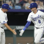 
              Kansas City Royals' Drew Waters celebrates with third base coach Vance Wilson after hitting a two-run home run during the fifth inning of a baseball game against the Cleveland Guardians Monday, Sept. 5, 2022, in Kansas City, Mo. (AP Photo/Charlie Riedel)
            