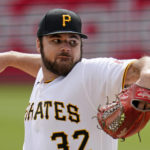 
              Pittsburgh Pirates starting pitcher Bryse Wilson delivers during the first inning of a baseball game against the Cincinnati Reds in Pittsburgh, Wednesday, Sept. 28, 2022. (AP Photo/Gene J. Puskar)
            