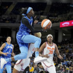 
              Chicago Sky's Kahleah Copper drives to the basket past Connecticut Sun's Courtney Williams during the second half of Game 5 in a WNBA basketball playoff semifinal Thursday, Sept. 8, 2022, in Chicago. The Sun won 72-63. (AP Photo/Charles Rex Arbogast)
            