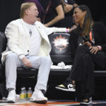 
              Las Vegas Aces owner Mark Davis, left, speaks with Aces president Nikki Fargas before Game 4 of a WNBA basketball final playoff series against the Connecticut Sun, Sunday, Sept. 18, 2022, in Uncasville, Conn. (AP Photo/Jessica Hill)
            