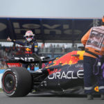 
              Red Bull driver Max Verstappen of the Netherlands stands next to his car after it broke down during the first laps of the first practice session ahead of Sunday's Formula One Dutch Grand Prix auto race, at the Zandvoort racetrack, in Zandvoort, Netherlands, Friday, Sept. 2, 2022. (AP Photo/Peter Dejong)
            
