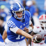 
              Kentucky quarterback Kaiya Sheron (12) hands the ball off during the second half of an NCAA college football game against Youngstown State in Lexington, Ky., Saturday, Sept. 17, 2022. (AP Photo/Michael Clubb)
            