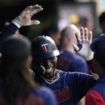 
              Minnesota Twins' Nick Gordon, middle, celebrates in the dugout after hitting a two-run home run against the Kansas City Royals during the second inning of a baseball game Thursday, Sept. 15, 2022, in Minneapolis. (AP Photo/Abbie Parr)
            