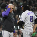 
              Colorado Rockies manager Bud Black talks with relief pitcher Justin Lawrence during the seventh inning of the team's baseball game against the Chicago White Sox on Tuesday, Sept. 13, 2022, in Chicago. (AP Photo/Charles Rex Arbogast)
            