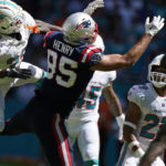 
              New England Patriots tight end Hunter Henry (85) can't hold on to a pass under pressure from Miami Dolphins cornerback Kader Kohou (28) during the second half of an NFL football game, Sunday, Sept. 11, 2022, in Miami Gardens, Fla. (AP Photo/Lynne Sladky)
            