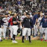 
              Players mill on the field after Chicago White Sox's Andrew Vaughn (25) was hit by pitch from Minnesota Twins reliever Jorge Lopez during the ninth inning of a baseball game in Chicago, Friday, Sept. 2, 2022. The White Sox won 4-3. (AP Photo/Nam Y. Huh)
            