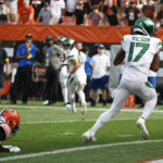 
              New York Jets wide receiver Garrett Wilson (17) takes a Josh Rosen pass into the end zone for a touchdown against the Cleveland Browns during the second half of an NFL football game, Sunday, Sept. 18, 2022, in Cleveland. (AP Photo/Ron Schwane)
            