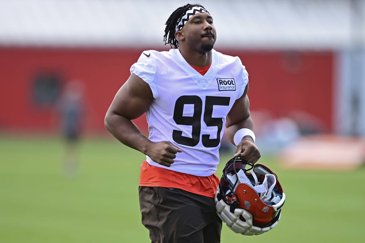 FILE - Cleveland Browns defensive end Myles Garrett runs during an NFL football practice in Berea, ...