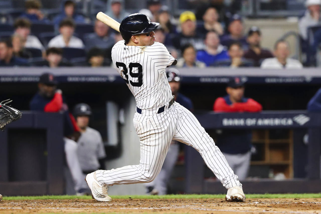 New York Yankees' Jose Trevino (39) hits an RBI single to score Oswaldo Cabrera during the fourth i...