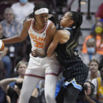 
              Connecticut Sun forward Jonquel Jones is guarded by Chicago Sky forward Candace Parker during the first half of Game 4 of a WNBA basketball playoff semifinal, Tuesday, Sept. 6, 2022, in Uncasville, Conn. (AP Photo/Jessica Hill)
            