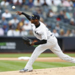 
              New York Yankees starting pitcher Domingo German throws during the first inning a baseball game against the Tampa Bay Rays on Sunday, Sept. 11, 2022, in New York. (AP Photo/Noah K. Murray)
            