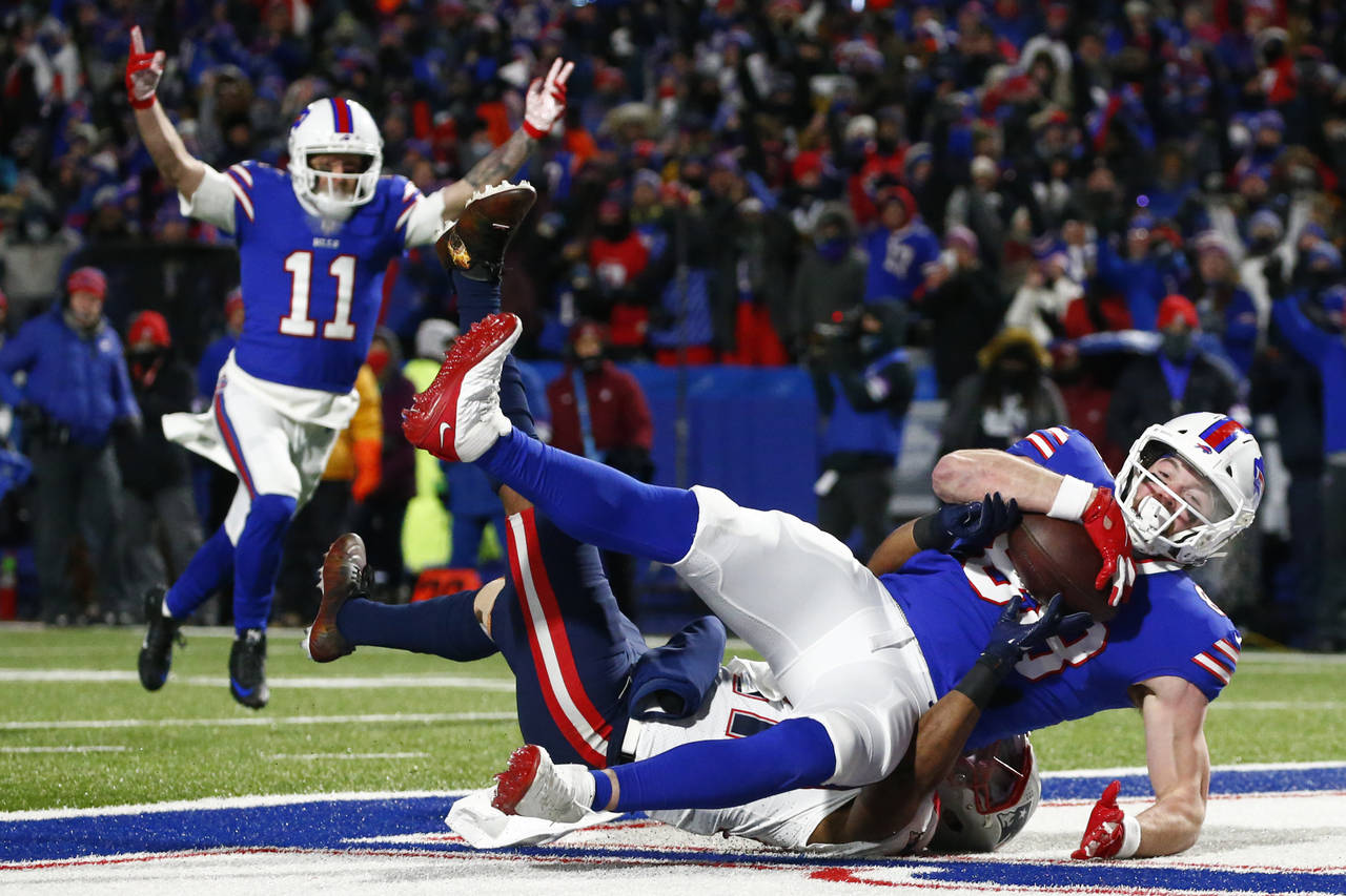 FILE - Buffalo Bills tight end Dawson Knox (88) makes a catch for a touchdown during the first half...