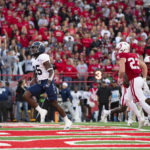 
              Georgia Southern's Jalen White (25) runs in a touchdown ahead of Nebraska's Isaac Gifford (23) during the first half of an NCAA college football game Saturday, Sept. 10, 2022, in Lincoln, Neb. (AP Photo/Rebecca S. Gratz)
            