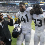 
              Jacksonville Jaguars linebacker Josh Allen (41) and linebacker Devin Lloyd (33) walk off the field after an NFL football game against the Los Angeles Chargers in Inglewood, Calif., Sunday, Sept. 25, 2022. (AP Photo/Marcio Jose Sanchez)
            