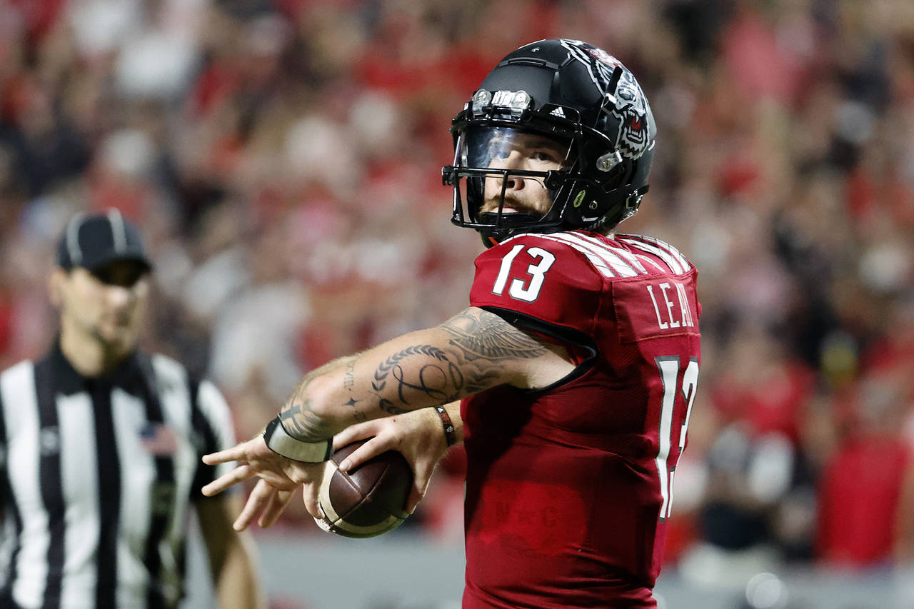 North Carolina State's Devin Leary (13) prepares to throw the ball during the first half of an NCAA...