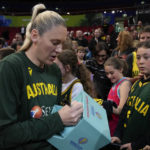 
              Australia's Lauren Jackson signs autographs following their win over Japan at the women's Basketball World Cup in Sydney, Australia, Tuesday, Sept. 27, 2022. (AP Photo/Mark Baker)
            