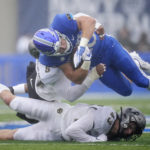 
              Air Force running back Brad Roberts, top right, is stopped after a short gain by Colorado linebacker Josh Chandler-Semedo and safety Trevor Woods in the first half of an NCAA college football game Saturday, Sept. 10, 2022, at Air Force Academy, Colo. (AP Photo/David Zalubowski)
            