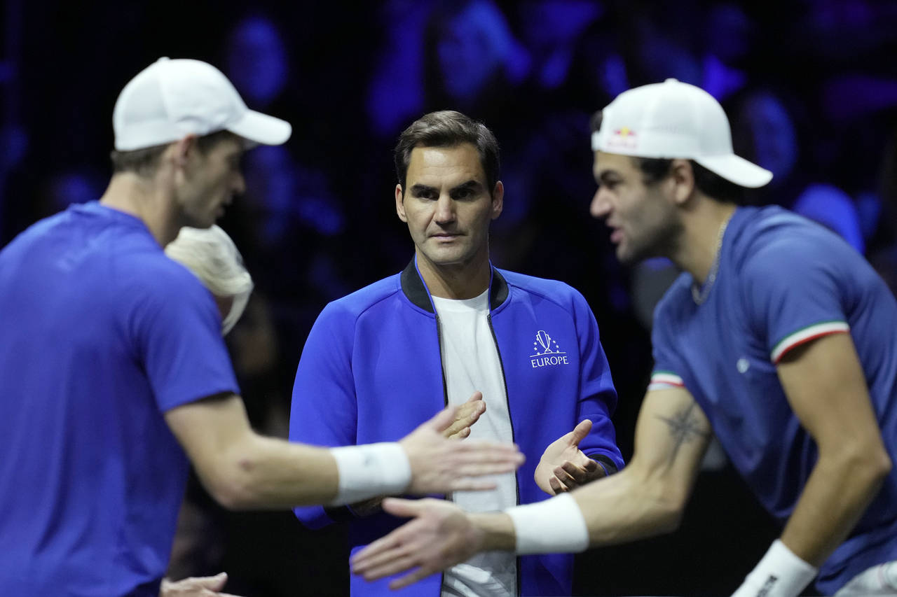 Team Europe's Roger Federer, center, looks at Andy Murray, left, and Matteo Berrettini during a mat...