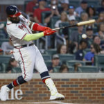 
              Atlanta Braves' Marcell Ozuna hits a double during the third inning of the team's baseball game against the Miami Marlins on Saturday, Sept. 3, 2022, in Atlanta. (AP Photo/Bob Andres)
            