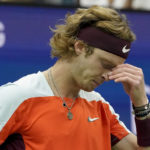 
              Andrey Rublev, of Russia, reacts after losing a point to Frances Tiafoe, of the United States, during the quarterfinals of the U.S. Open tennis championships, Wednesday, Sept. 7, 2022, in New York. (AP Photo/Mary Altaffer)
            