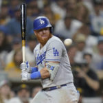 
              Los Angeles Dodgers' Justin Turner reacts to a high, inside pitch while batting during the seventh inning of the team's baseball game against the San Diego Padres, Tuesday, Sept. 27, 2022, in San Diego. (AP Photo/Gregory Bull)
            