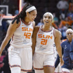 
              Connecticut Sun center Brionna Jones celebrates with guard DiJonai Carrington after Carrington hit a basket after a steal from the Chicago SKy at the end of the first half during Game 4 of a WNBA basketball playoff semifinal Tuesday, Sept. 6, 2022, in Uncasville, Conn. (AP Photo/Jessica Hill)
            