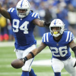
              Indianapolis Colts safety Rodney McLeod (26) celebrates an interception with Tyquan Lewis (94) during the second half of an NFL football game against the Kansas City Chiefs, Sunday, Sept. 25, 2022, in Indianapolis. (AP Photo/AJ Mast)
            